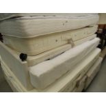 Single bed base with mattress and trundle bed under