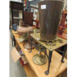 Quantity of copper and brassware to include a trivet, candlesticks, measures, pots and ornaments