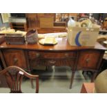 Serpentine front dark wood sideboard on fluted legs