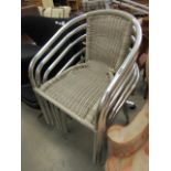 Six wicker effect and chrome stacking armchairs