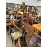 Cast iron lamp stand with oil lamp head