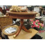 Circular occasional table with carved detail