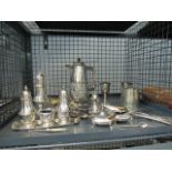 A cage containing silver plate to include: goblets, teapot, sugar shaker, cruet sets and loose