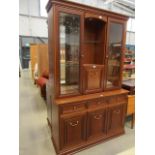 Mahogany display unit with glazed sections above and drawers below