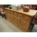 Large pine chest with an assortment of 19 drawers