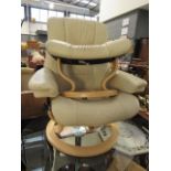 Cream leather swivel lounge chair with stool