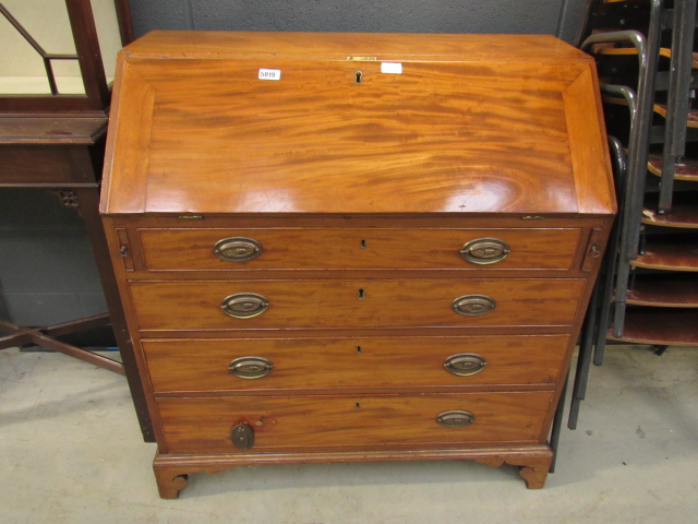 Drop front bureau with 3 drawers below