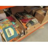 4 boxes containing childrens annuals, reference books and novels