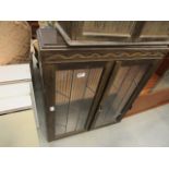 Two door glazed display cabinet in dark wood