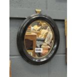 Oval mirror in ebonised frame
