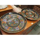 A pair of black painted and floral decorated trays