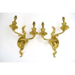 A pair of Danish gilt metal twin wall sconces with foliate bodies by Christiansen Brothers