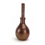 An Eltonware bottle vase of slender form decorated with a plain copper coloured crackle glaze, h.