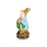 A Halcyon Days Beatrix Potter enamel box modelled as Peter Rabbit, h. 9.