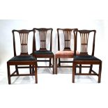 A set of four Georgian mahogany splat-back dining chairs with drop-in seats and square front legs