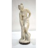 A statuette modelled as a lady wrapped around by a sheet, standing on a boulder, unsigned, h.