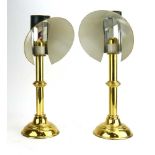 A pair of brass sprung-loaded candlesticks with green enamelled and mirrored reflecting shades, h.