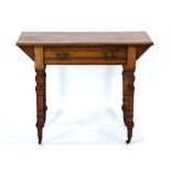 A late 19th/early 20th century writing/console table with a single frieze drawer on turned supports