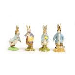 Four Beswick Beatrix Potter figures: Peter Rabbit Digging, Peter with Postbag,