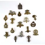 A group of eighteen cap badges relating to cavalry regiments including King Edward's Horse, BADS,