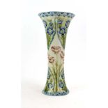 A McIntyre florianware vase of slender tapered form, relief decorated with poppies and cornflowers,
