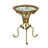 A 20th century Aesthetic Movement-style brass occasional table,