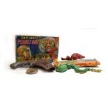 A mixed group of toys including a Tri-ang clockwork Loch Ness Monster, boxed,