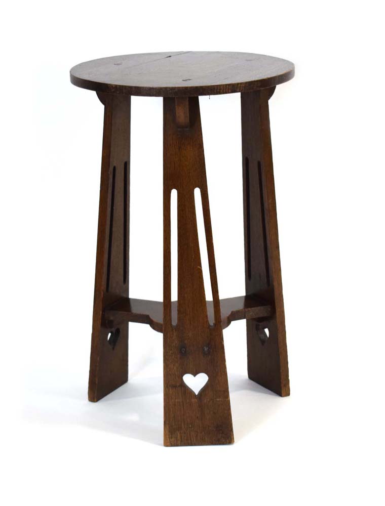 A Commercial Arts & Crafts oak occasional table on three splayed splat legs with piercework hearts, - Image 2 of 4