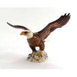 A Beswick figure modelled as a bald eagle, model no. 1018, h. 20.