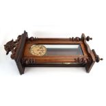 An early 20th century Continental Vienna-type wall clock in a walnut case