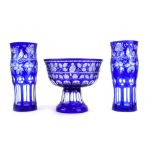 A Bohemian clear and blue flash glass bowl of goblet form engraved with stylised birds,