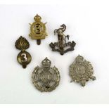 A group of five London volunteer regiment cap badges including the 3rd City of London Rifles