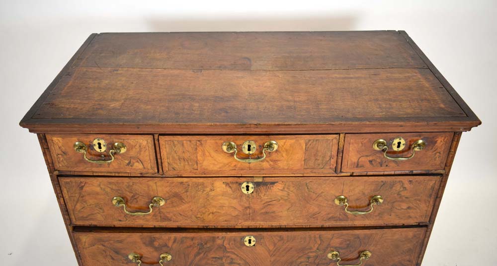 A Georgian walnut and feather crossbanded chest of three short over three long drawers on later bun - Image 2 of 27