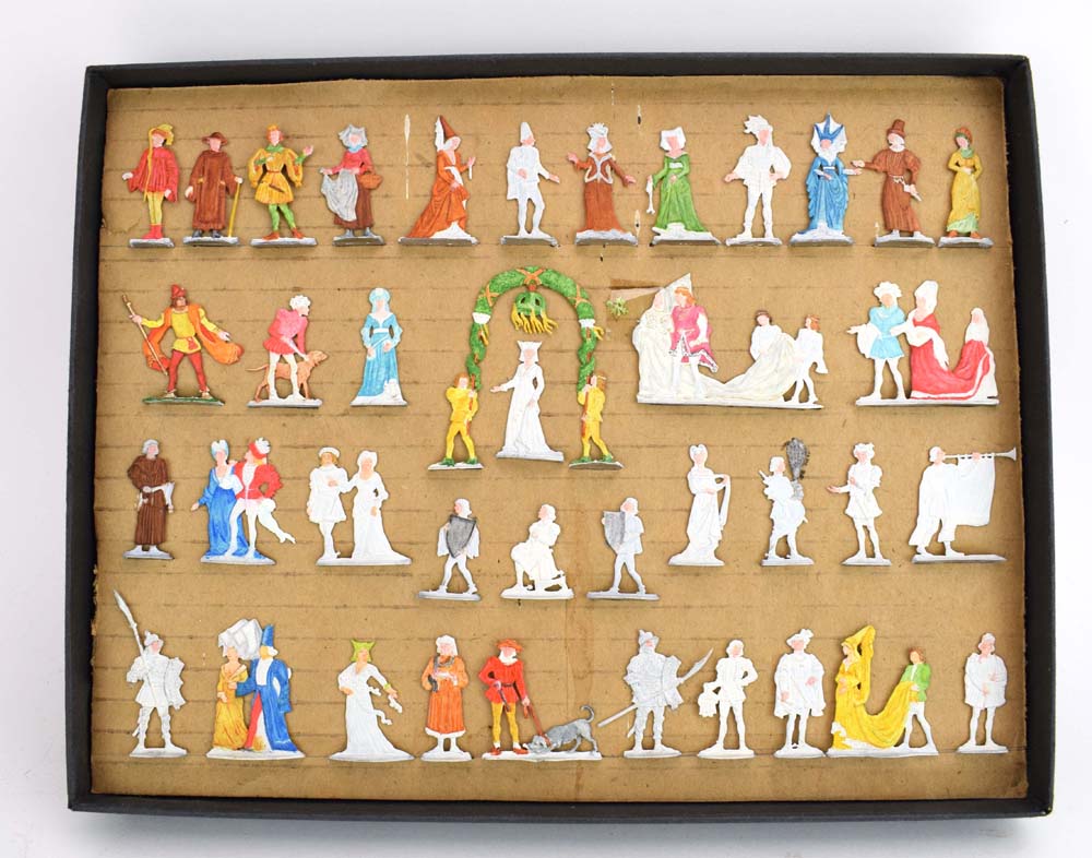 A collection of German cast flat metal figures modelled as Medieval locals, court figures,