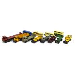 Twelve playworn Dinky models comprising eight Foden and other flatbed trucks and four buses (12)