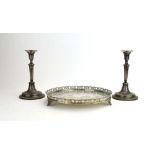 A continental metalware tray of circular form with rococo style gallery on three foliate feet, d.