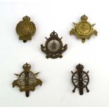 A group of five cyclists cap badges incl.