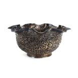 An early 20th century Chinese export metalware sugar bowl of scalloped form relief decorated with