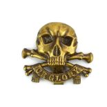 A 17th Lancers cap badge