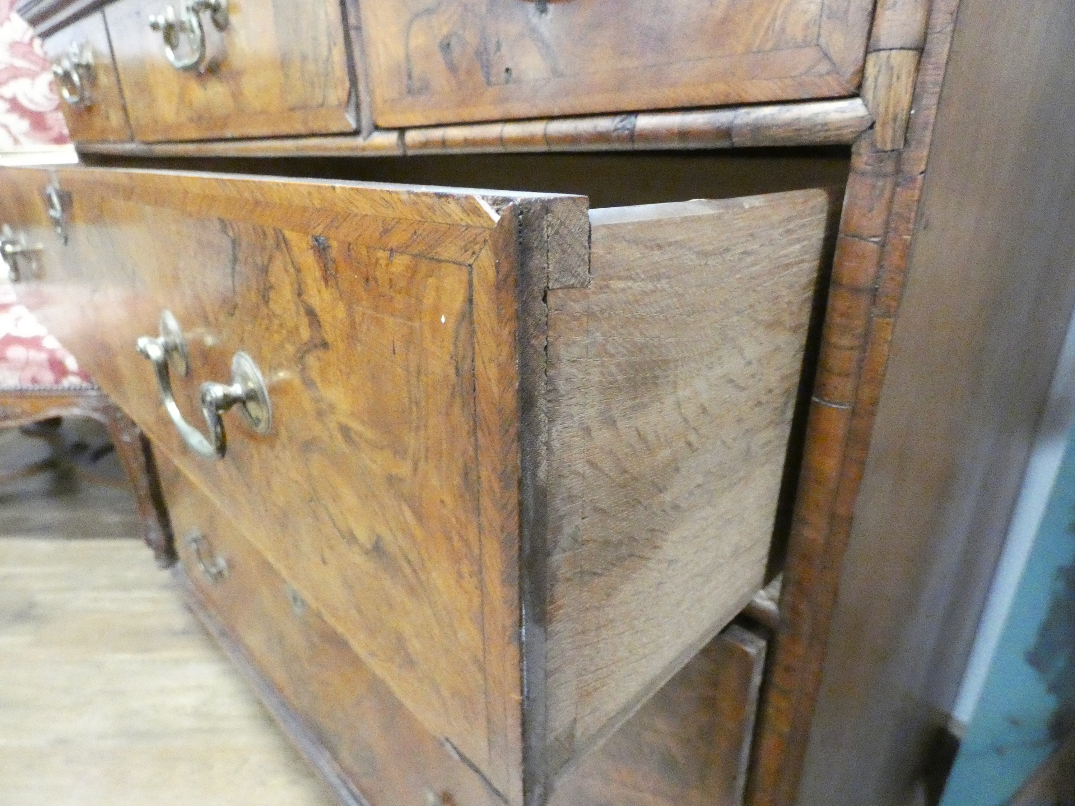 A Georgian walnut and feather crossbanded chest of three short over three long drawers on later bun - Image 15 of 27