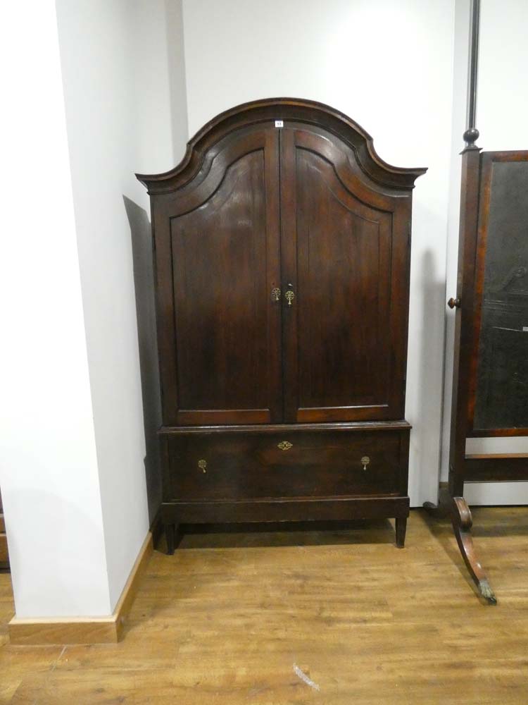 A Dutch oak cupboard, the two panelled doors enclosing gilt fretwork interior,