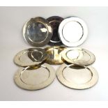 A set of eight Mexican metalware plates of circular form, d.