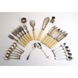 A mixed group of silver comprising a set of six teaspoons, seven further teaspoons,