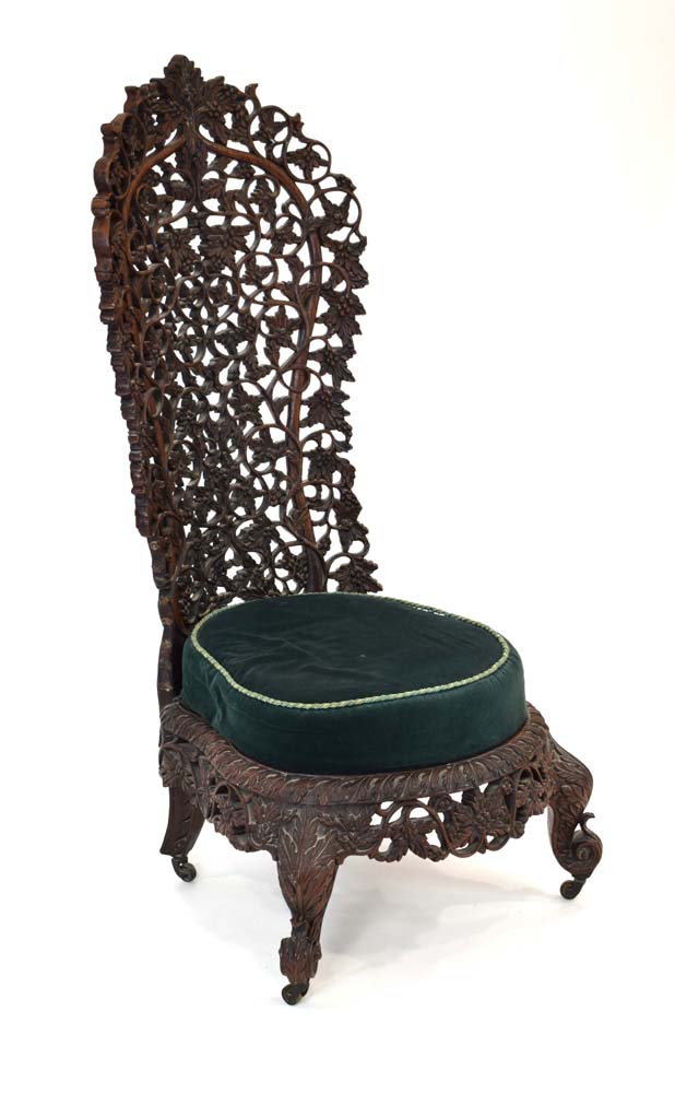 An Anglo-Indian fretwork hall chair intricately carved with fruiting vines, - Image 2 of 5