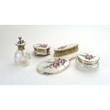 A mid-20th century silver six piece dressing table set decorated in coloured enamels with floral