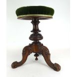 A late 19th/early 20th century mahogany adjustable piano stool with a button upholstered seat