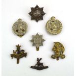 A group of seven various volunteer cap badges including Artists, Royal Guernsey, Rifle Brigade etc.