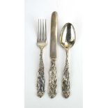 A metalware three piece Christening set comprising knife, fork and spoon,