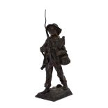 An early 20th century bronze figure modelled as a boy carrying his fishing equipment,