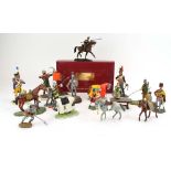 A group of painted metal figures modelled as Edwardian ladies, an archer, jousting figures,